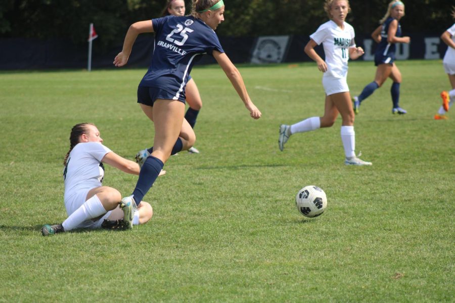 Senior Ava Miller wins the ball from a sliding defender on Madison Comprehensive. Granville won the game 1-0.