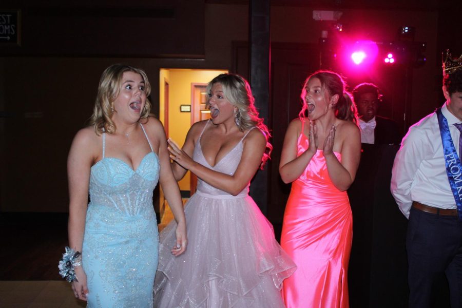 Anna Belt, Ella Kunar, and Lori Horde excitedly celebrate Belt winning Prom Queen. 