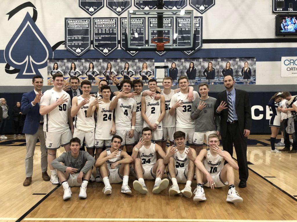 The Granville Blue Aces boys basketball team poses after clinching their fourth consecutive Licking County League Buckeye title in 2019. (Photo courtesy of Wendy Cottrell)