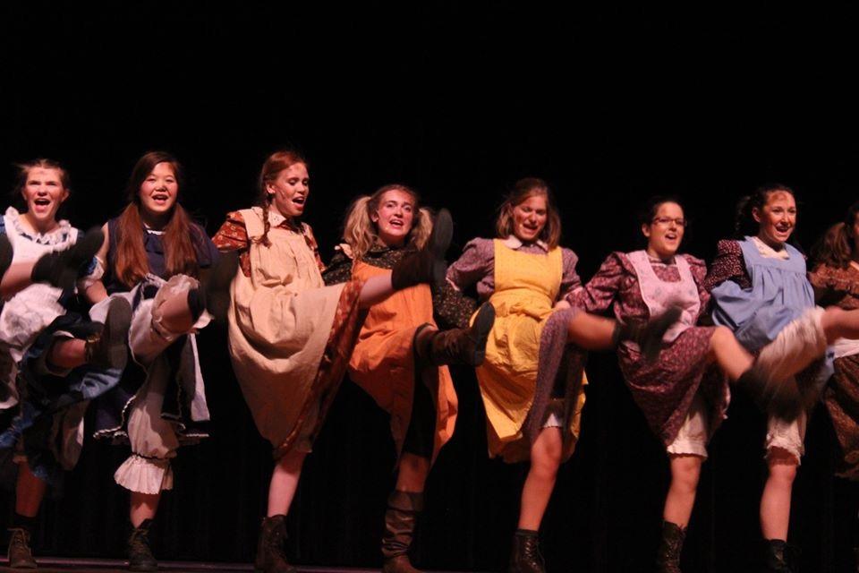 Actresses, such as Anya Mitton-Fry, Esme Chin-Parker, Katie Gold, Gabriela Shcnidt, Sydney Flora, Allison Collins, and Alexa Mitton, dance in Its A Hard knock Life. Photo courtesy to Lexi Robertson