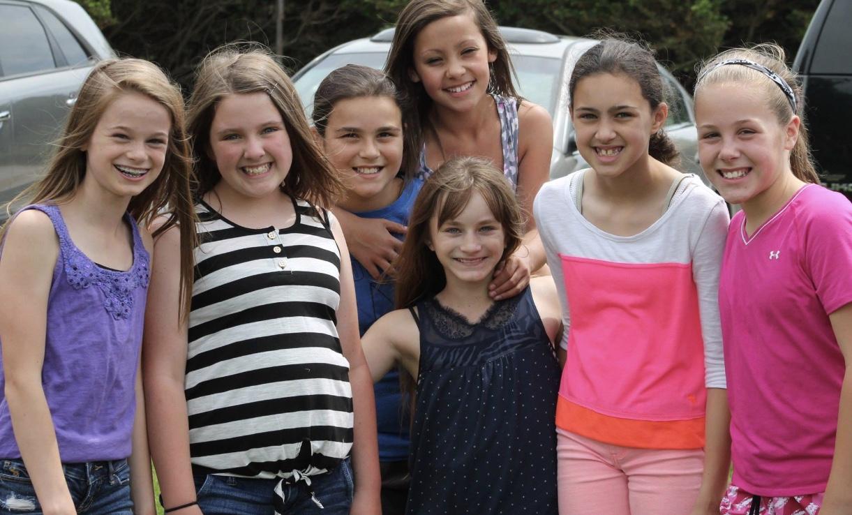 During the 5th Grade Picnic, Julia Patton, McKenna Beitzel, Ella Gravitt, Abigal Burkholder, Lillie Long, Olivia Garland, and Sophie Shaw all pose for a picture. 
