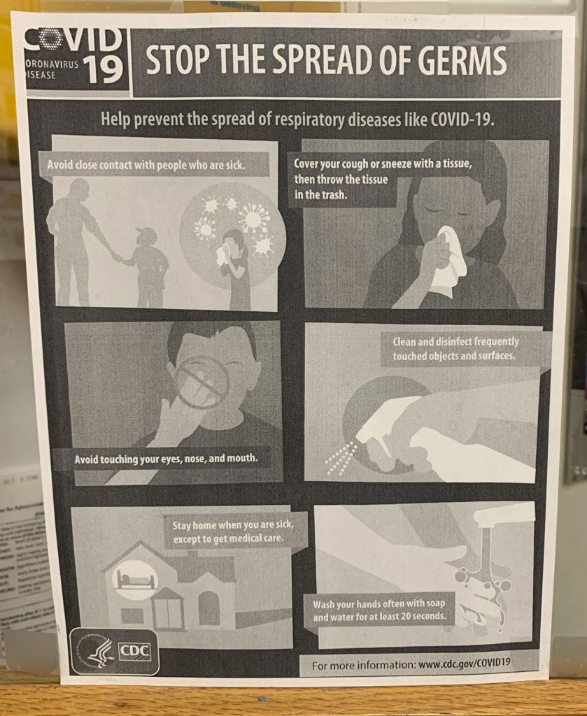 A sign on high school nurse Ann Varrassos door educating the students on how to stop the spreading of germs. Blueprints/ Lauren Kiernan 