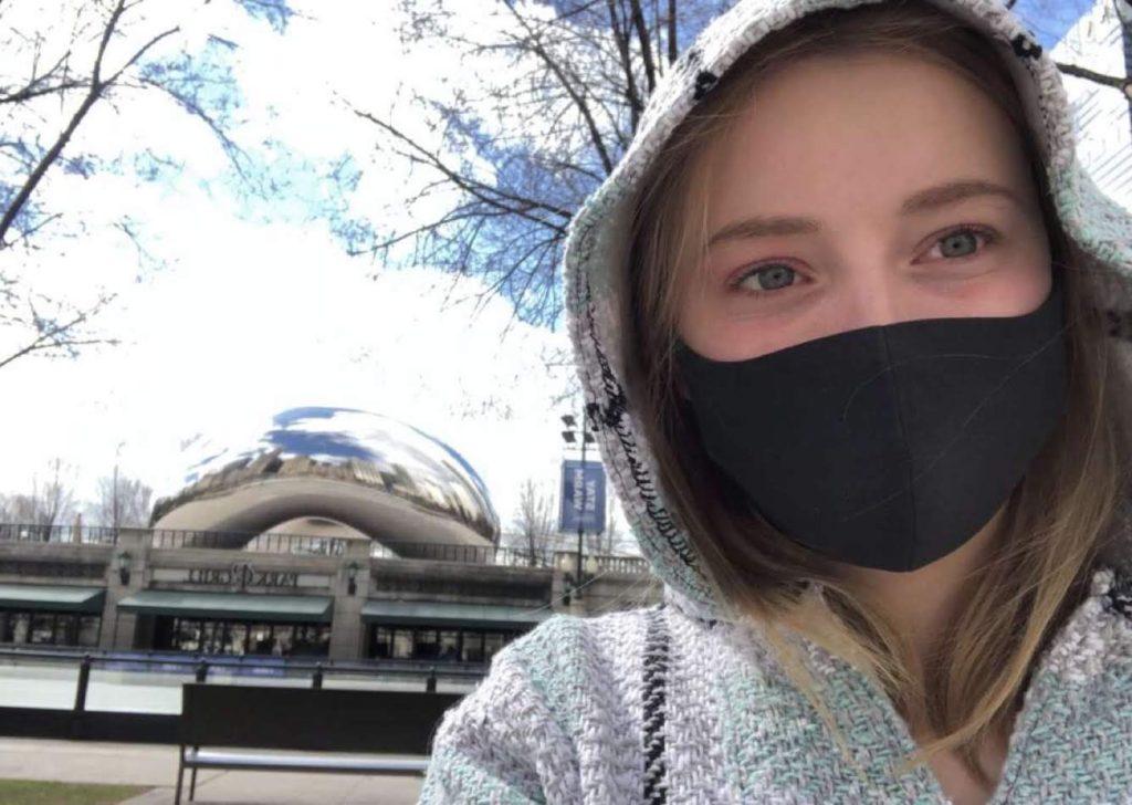 Agnete Maria Vonheim puts on a mask in front of the airport before heading back to Norway. 