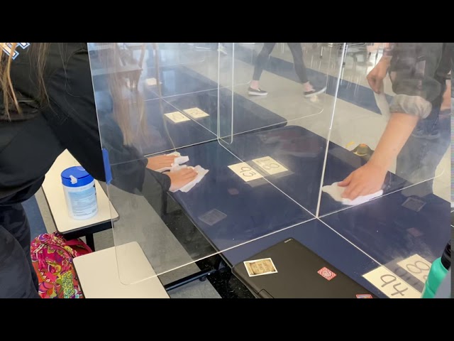 Students wipe out Coronavirus germs on high touch surfaces