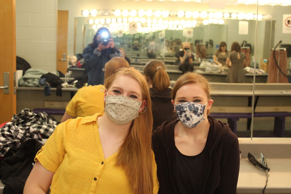 Sophomore Lucy Waggoner (Nina) poses with her sister Roxy, a makeup and costume crew member, pose before all-day tech. Due to Covid-19 regulations, all cast and crew members had to wear masks.
BluePrints Photo by Kennedy Ogden