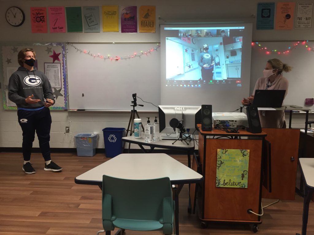 An in-person drama student performs a monologue in front of a camera so remote students can view his performance. Drama teacher Sara Sharp was one of twenty teachers to receive equipment from the grant.