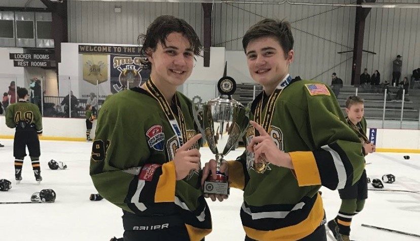 Juniors Matt and Mikey Chaykowski pose after winning a championship cup several years ago. They have been playing with the Generals since elementary school.