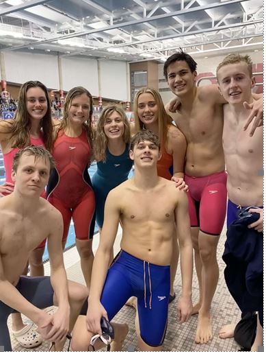 Graham Mayberry, Avery Spiker, Avery Koester, Carmen Wells, Caroline Otter, Jacob Teeter, Julian Rodgers, and Josh Remlinger pose for a picture after a meet. Photo courtesy of Caroline Otter.