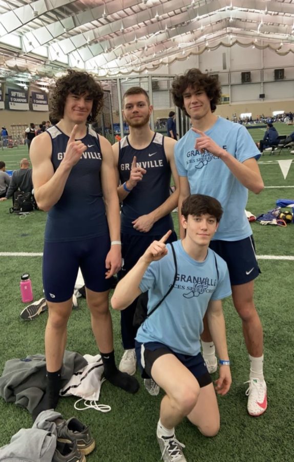 Dom Costa, Owen Ketron, Aidan Flarety, and JJ Herro pose after their school record breaking race at Akron University.