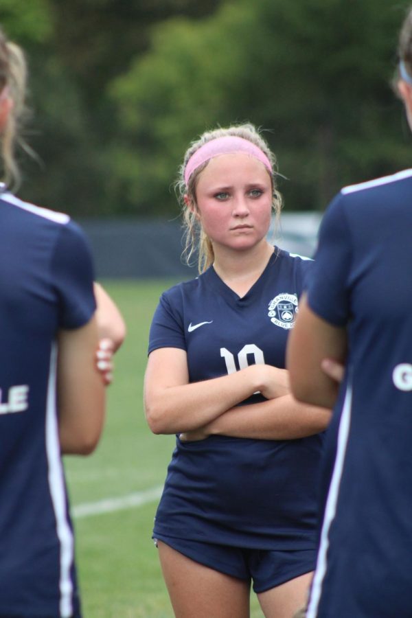 Sophomore Anna Nolan listens intently to what Coach Forster says at halftime. Granville went on to win the game 4-2.