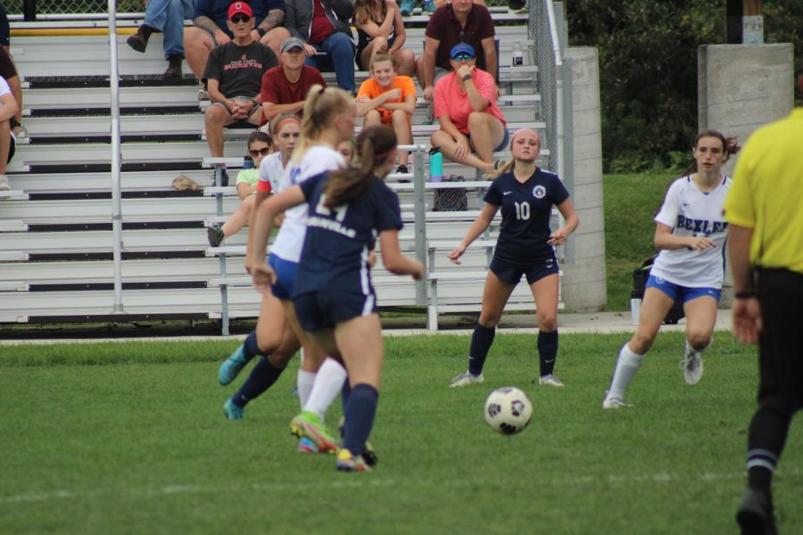 Junior Lyndy Van Horn and sophomore Anna Nolan attempt to defend a Bexley midfielder. Granville went on to win the game 4-2.