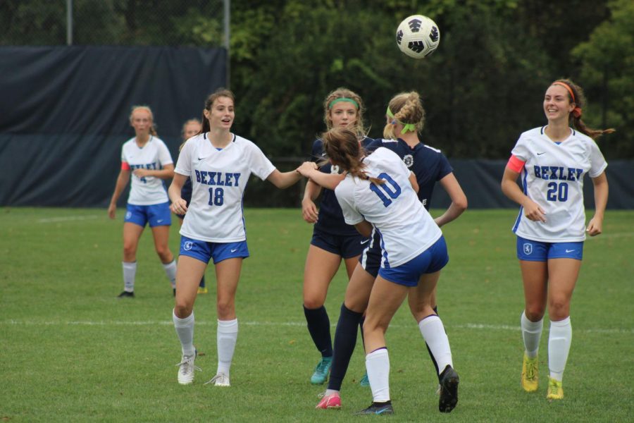Sophomore Hope Mahl jumps up for a header against a rival player from Bexley. Granville went on to win the game 4-2.