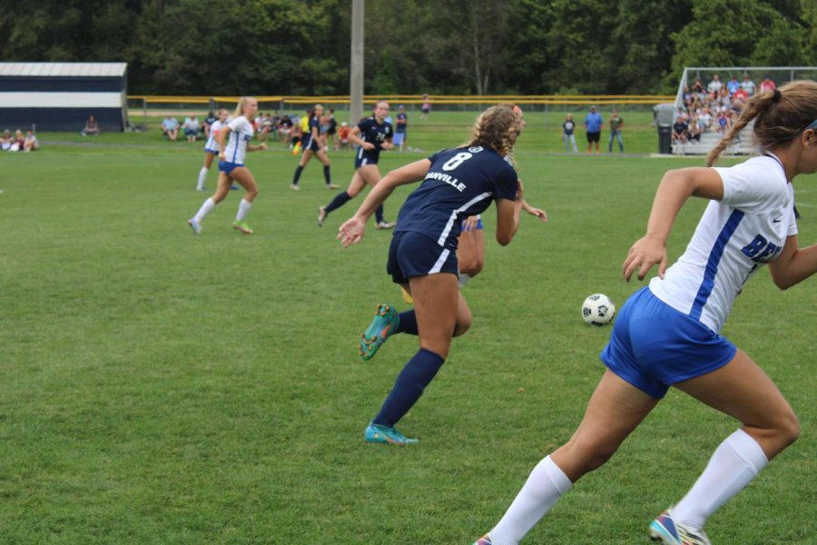 Junior Allie Messner races to win the ball from a Bexley player. Granville went on to win the game 4-2.