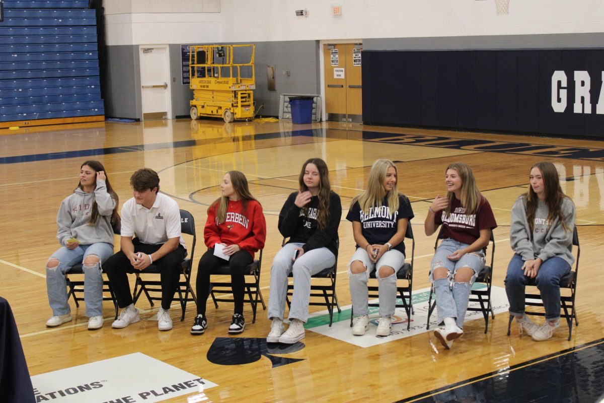 Bella Rockwell, Maxton Messner, Aliyah Moore, Harper Annarino, Ava Labocki, Allie Messner and Lyndy Van Horn wait to sign their NIL paperwork. All seven athletes committed to playing at the collegiate level at a ceremony on Nov. 9.