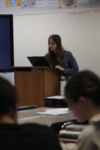 Miss Doll teaching her French 4 class