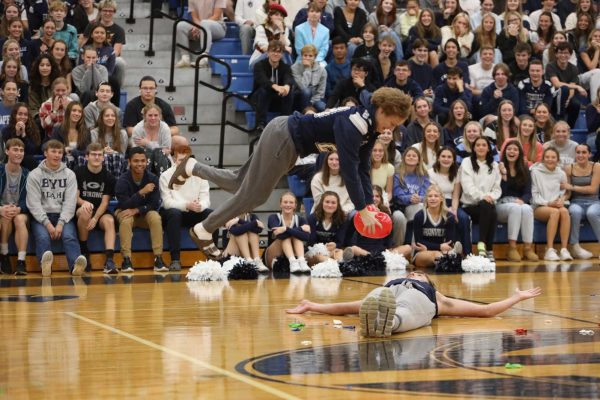 Senior AJ Buerkel goes vertical before smashing his balloon on classmate Cooper Phillips. The pair won the event in a close finish.