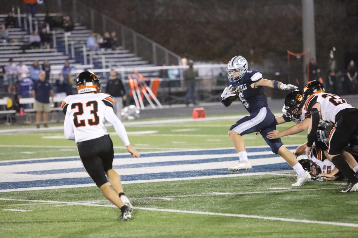 Theo Talbott runs the ball towards the endzone.