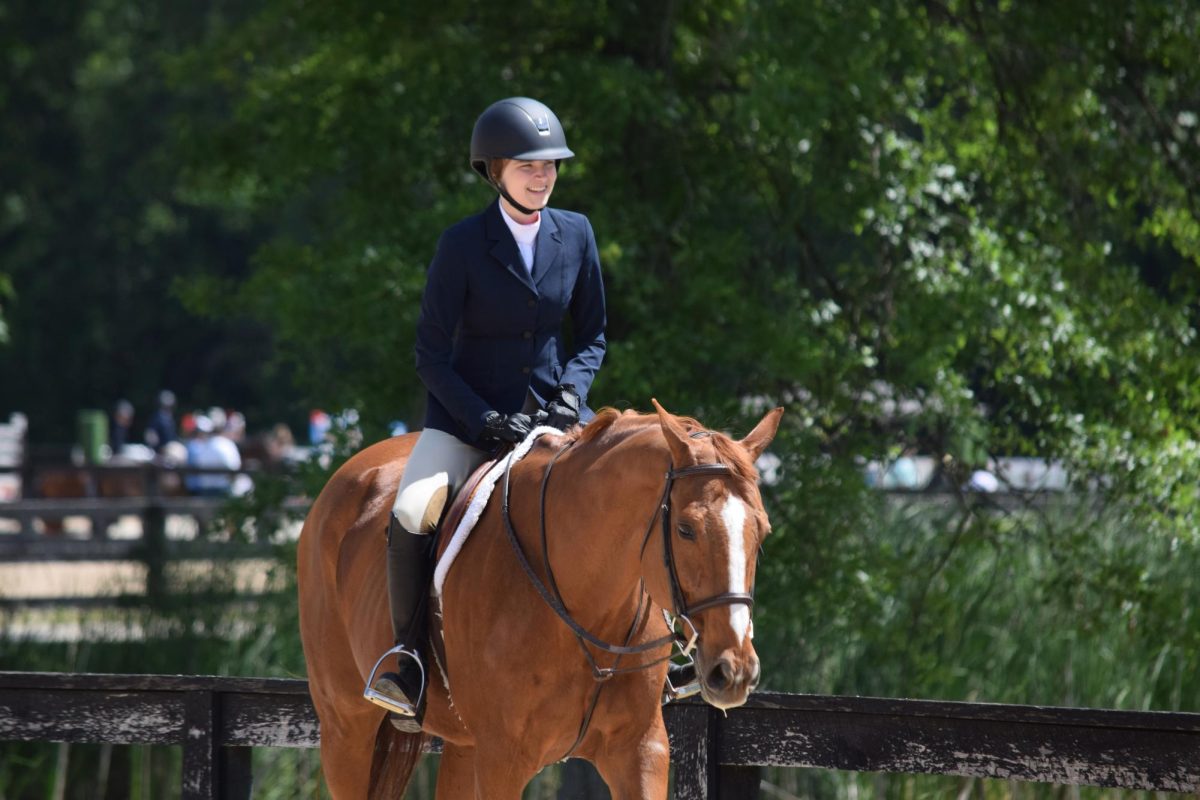 Anna Squire and Merlin warm up before a NEST show in June 2024. The show was Anna's first major event after sustaining an injury at horse camp the previous summer. Photo courtesy of Anna Squire