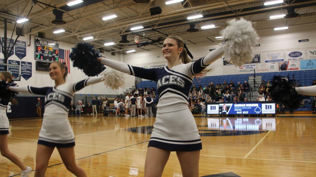 Senior cheerleader Caitlin Koney beams at the crowd while performing. Granville prevailed 58-40 over visiting Northridge on Jan. 8.