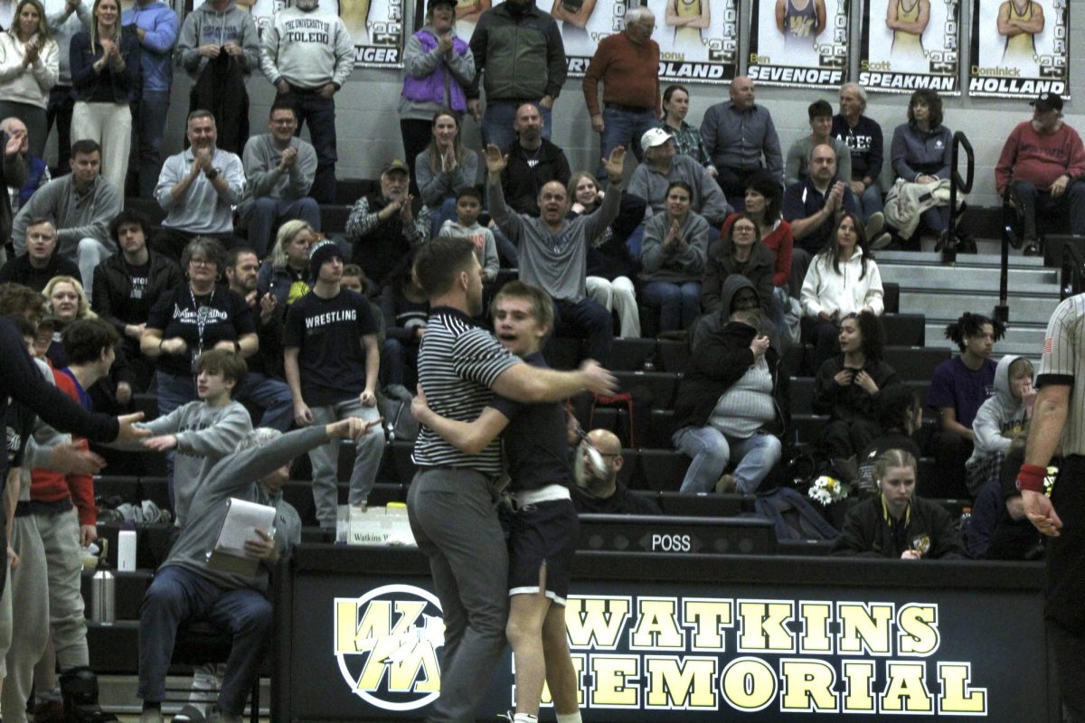 Coach blank and blank blank blank hug in celebration after the match. 