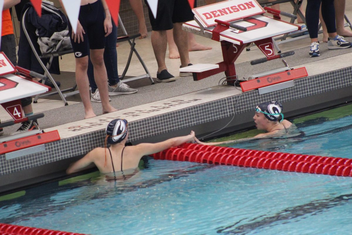 Blake Witter (10) and Lily Hyslop (10) high five after finishing their event. Granville sets new records, brings home new trophies, and swimmers Lydia Sturgeon and Nolan Schneider are crowned LCL swimmers of the year. 
