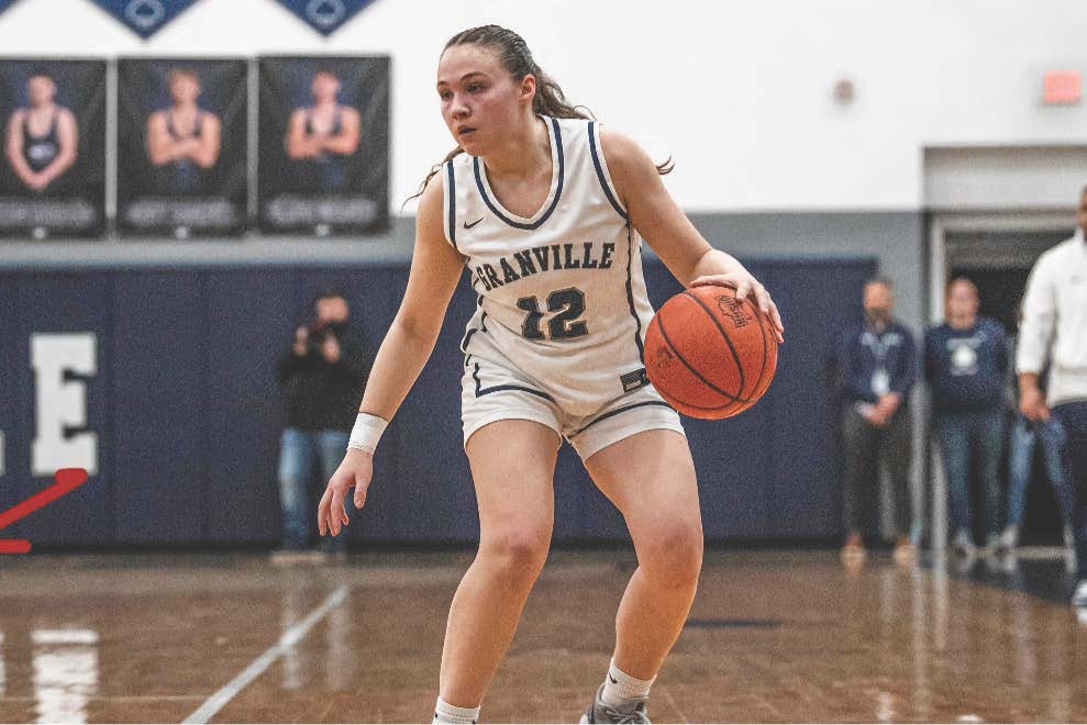 Katie Cottrell dribbles down the court during a varsity girls basketball team. After being cut from the volleyball team as a freshman, Cottrell refocused her energy on basketball, a decision that has proven pivotal to her team's success.