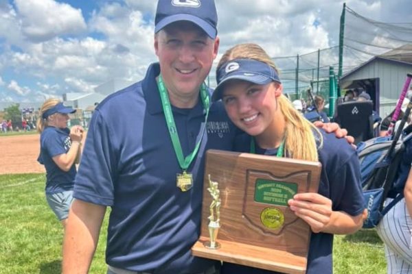 Coach Brooke poses with his daughter, Taylor, after the 2024 championship. Brooke started coaching the softball team in 2022. Photo courtesy of Coach Brooke.
