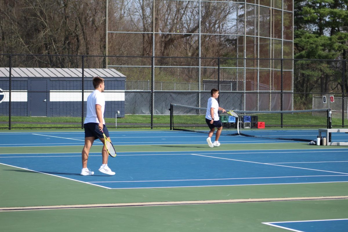 Kyle Kirby and his partner Connor Kirby wait for the serve from their opponents. 