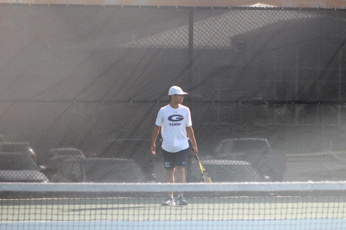 Alex Organ watches the other matches around him while readying himself for his own. 