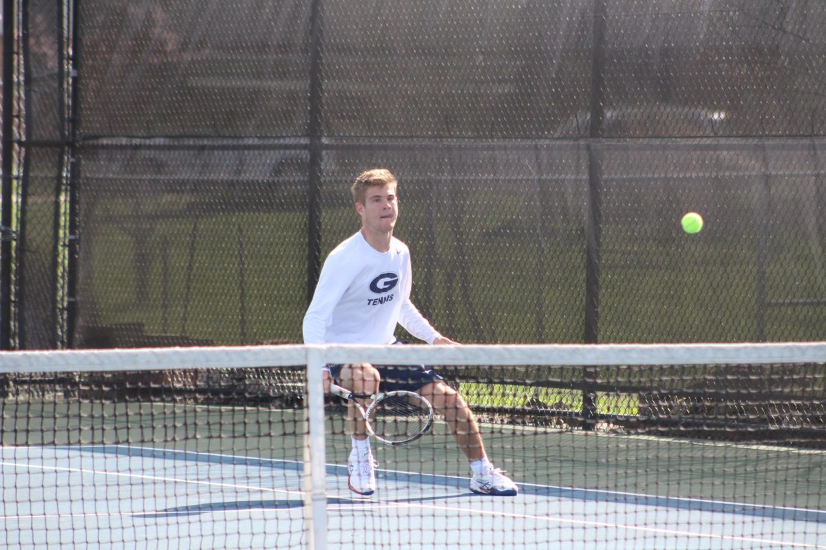 Samuel Pfau stops short of the net after hitting the ball over it just in time. 