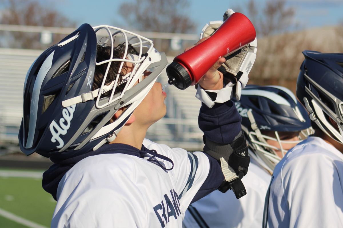 A Granville player hydrates between plays.