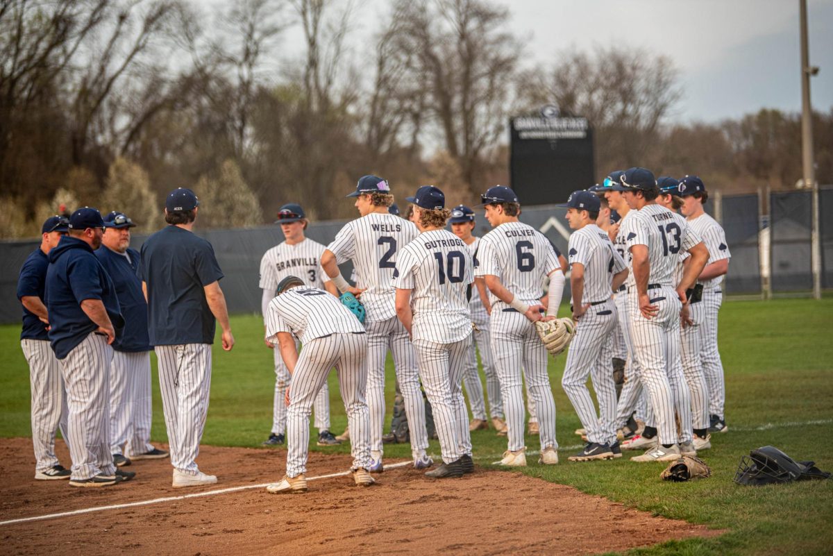 The team huddles up postgame, reflecting on a strong performance. 