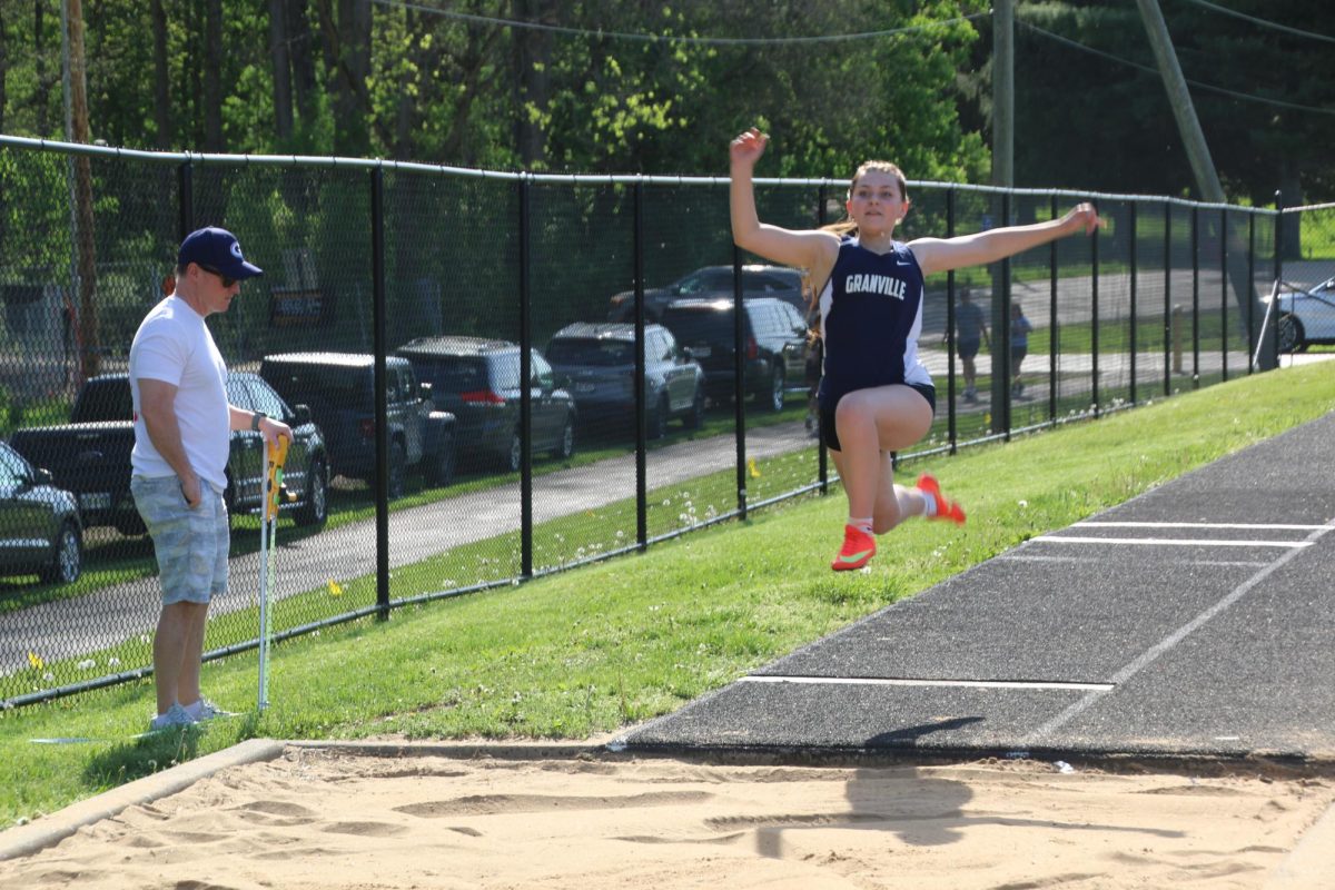 Kaitlyn Coen (9) completes the long jump
