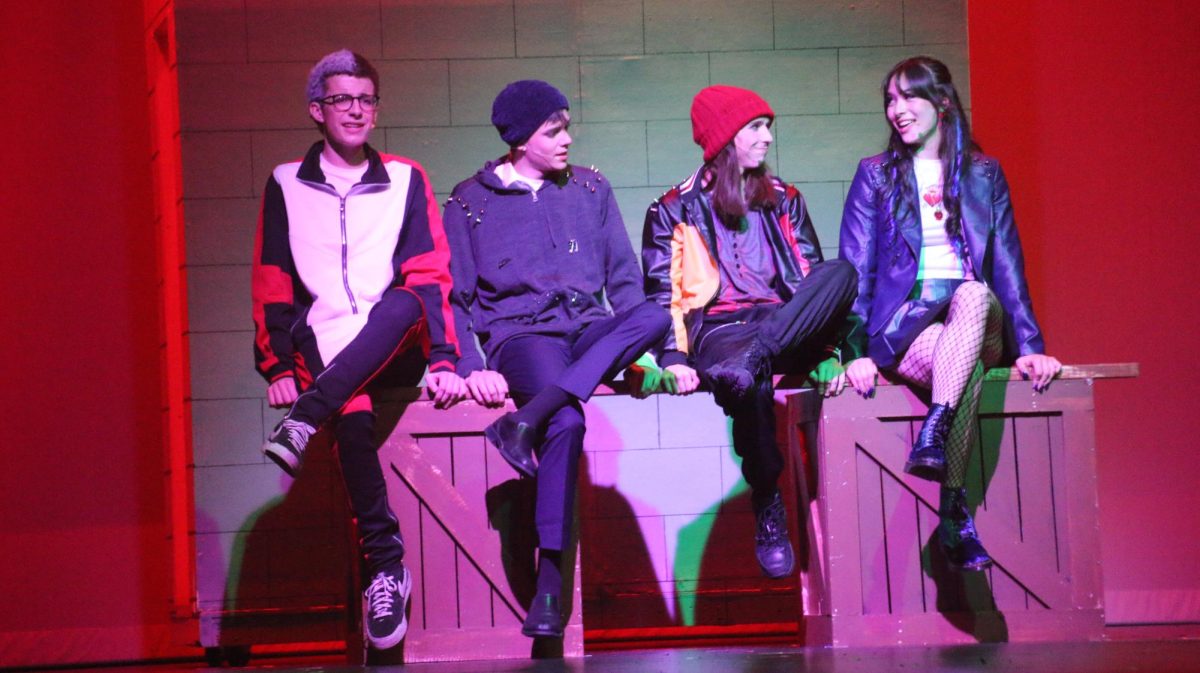 Andrew Busack (10), Owen Costa (11), Max Holtsberry (11), and Miho Gillespie (12) sing about how to act like an Evil in "Chillin' Like a Villain."
