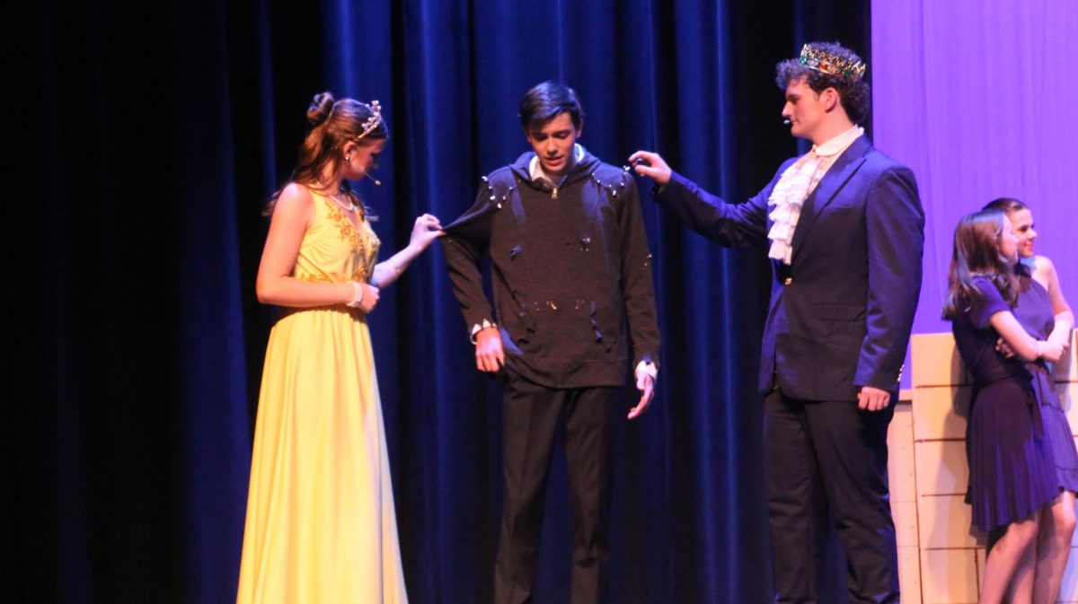 Sydney Eggert (11) and Jackson Lough (10) question their son Ben's, played by Owen Costa (11), clothing after his return from the Isle of the Lost. 