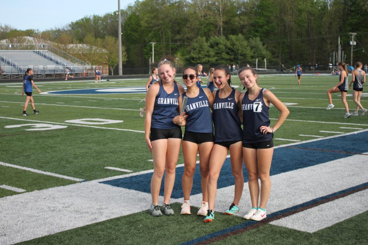 Junior Abby Boissy, junior Val Vivas, sophomore Margaret Mcdonald and sophomore June Landry are hyped up for their 4x1600m.