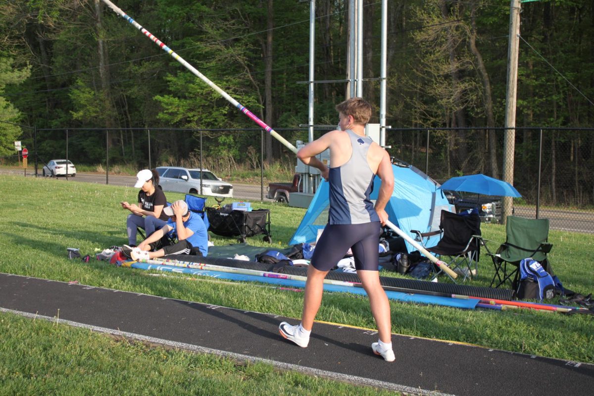 Sophomore Devin Bodle gets ready to pole jump. 