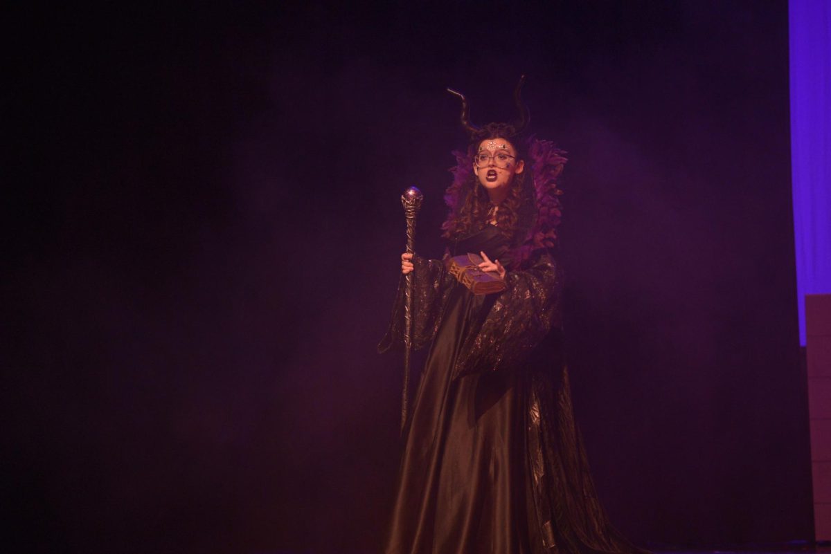 Scarlett Woltz (11) makes her grand entrance as the most feared villain, Maleficent. 