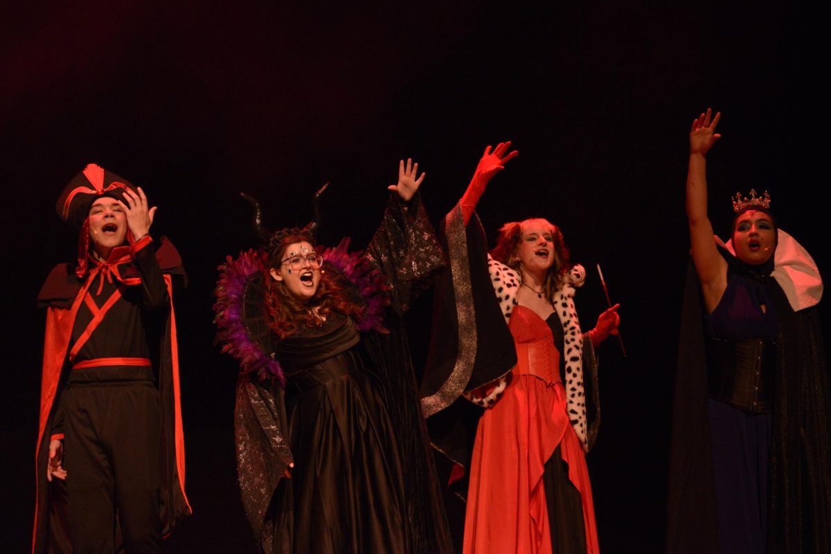 Zack Binckley (12), Scarlett Woltz (11), Elliott Smith (10), and Evie Lechuga (12) celebrate their evil plan. 