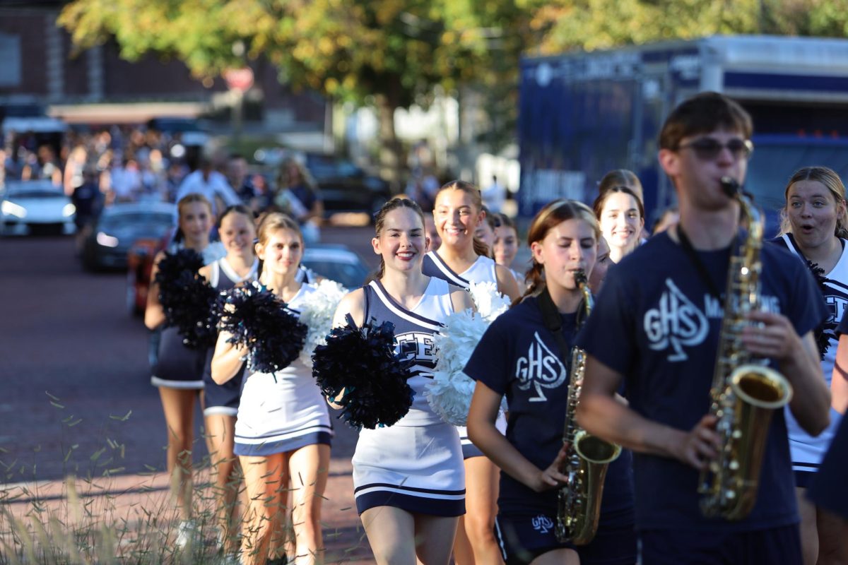 Senior MacKenzie BeVier is all smiles as she starts the parade on Sept. 14. 