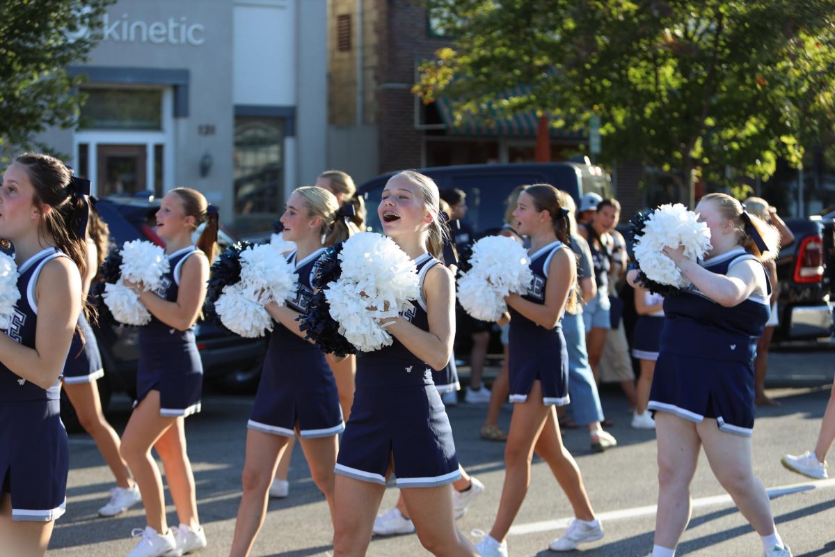 Freshman Lauren Bodle brings Aces spirit down Broadway during the Sept. 14 Homecoming parade.