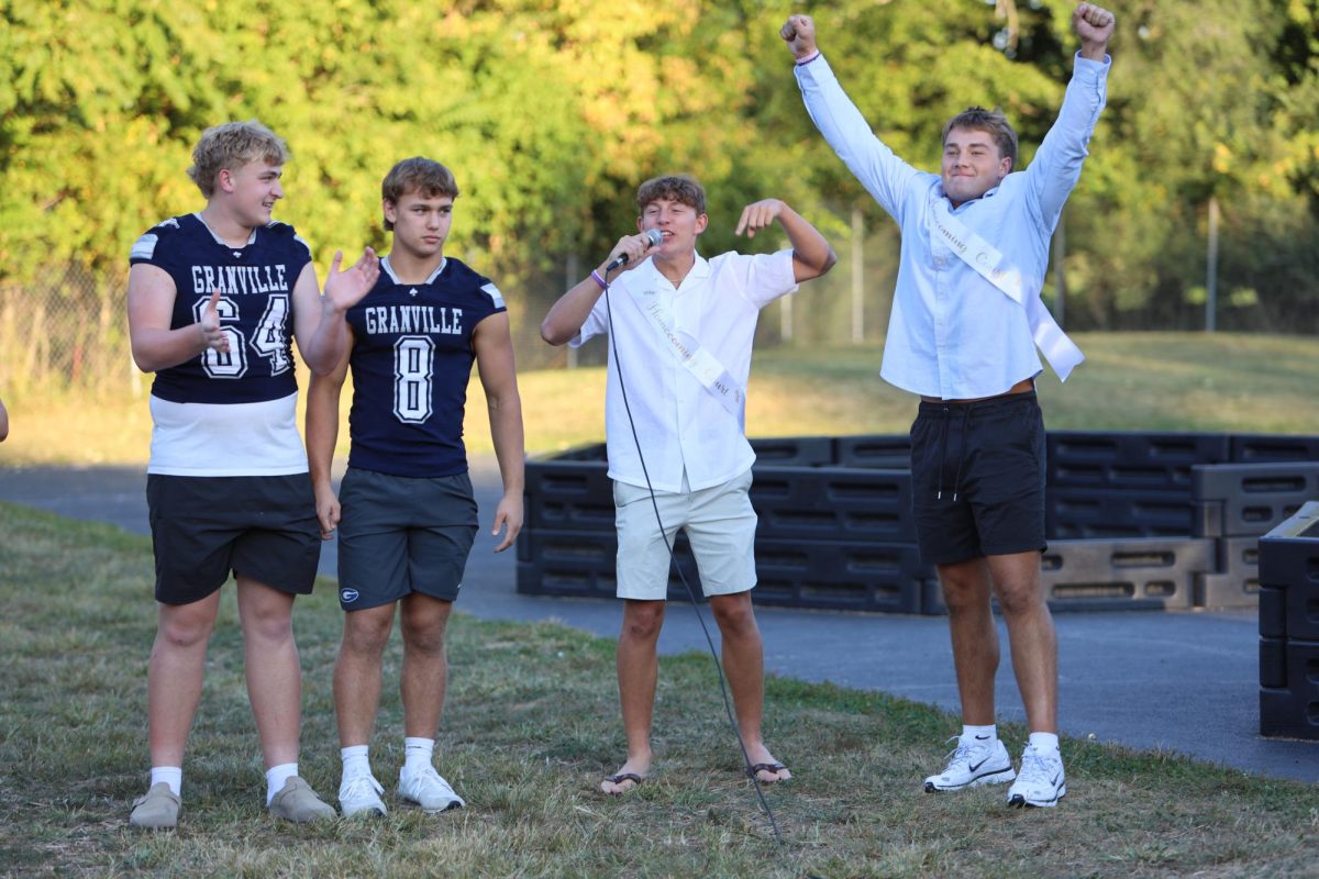 Football captains Kyle Kirby (12), Landon Goss (12), Luke Sanchez (12) and Cooper Gregory (11) hype up the crowd for the Homecoming game.