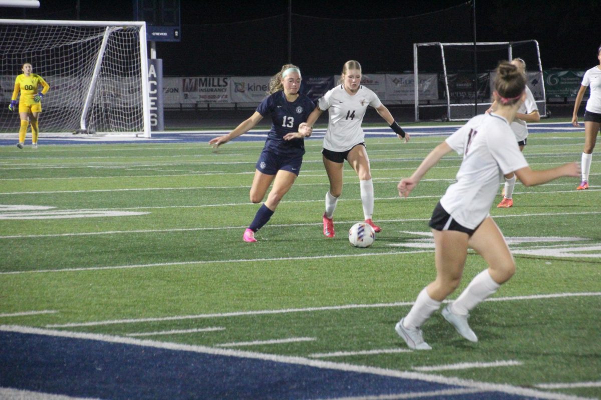 Ayla Cook fights for the ball against a Licking Heights player. With the team demolishing Licking Heights 6-0, the girls are still fighting strong to keep possession of the ball. 
