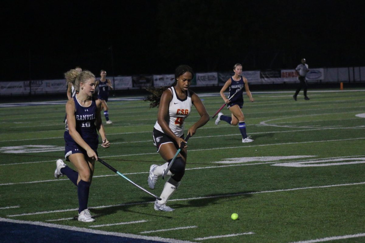 Sophomore Vivia Lewis tracked down a Columbus Academy player. She is a prominent player for Granville during this match. 