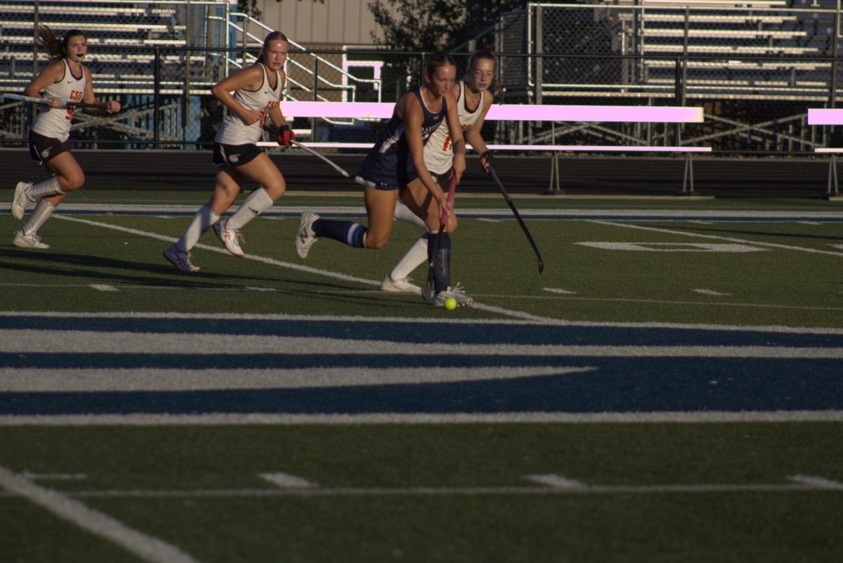 Senior Brooke Smith prepared to strike the ball. Brooke  is a crucial member of the team.