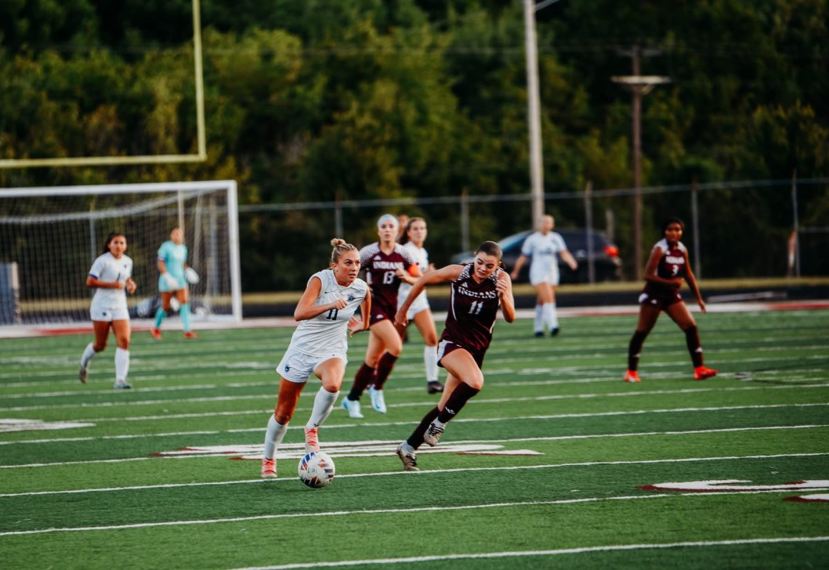 Junior Ivy Miller races with the ball before scoring against Canal Winchester.