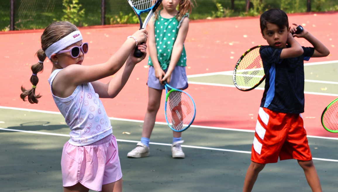 Young girls and boys playing tennis, representing early youth participation in sports. Courtesy of the City of Kent, Ohio (kentohio.gov).

