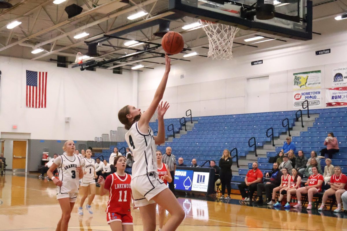Sophomore Annika DeJong goes for a layup in the varsity game against Lakewood. Annika had made a large impact on the team's points. She scored these 2 points, helping with their win. 