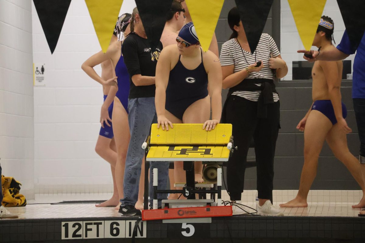 Caroline Rich gets ready for her race during the Jan. 9 swim meet at Upper Arlington. She had a good race and swam fast. 