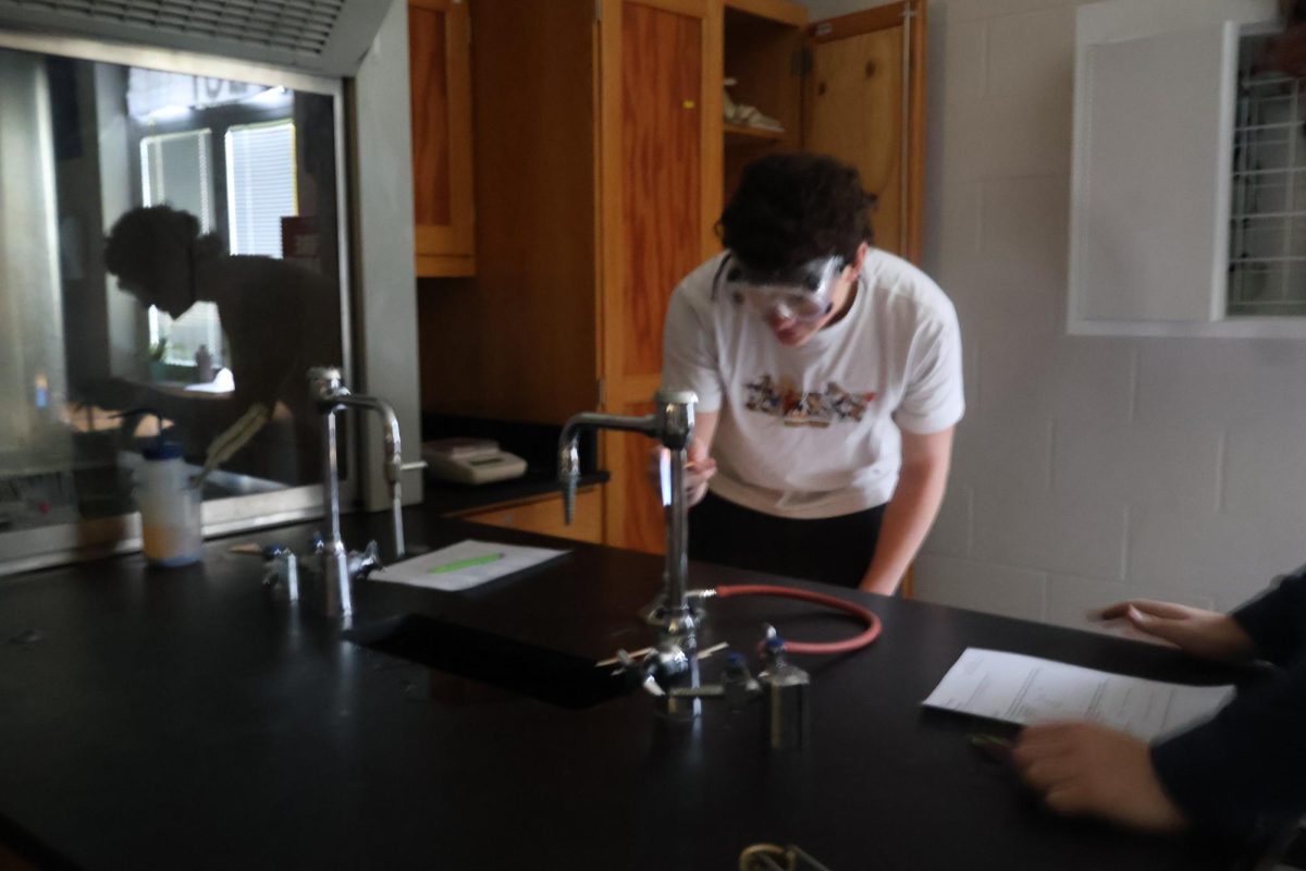 Hayden Barker (10) lights his flame and watches intensely during his lab.